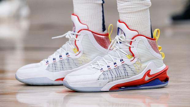 View of Nikola Jokic's white, red, and blue Nike shoes.