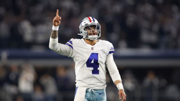 Dallas Cowboys quarterback Dak Prescott celebrates during a game.