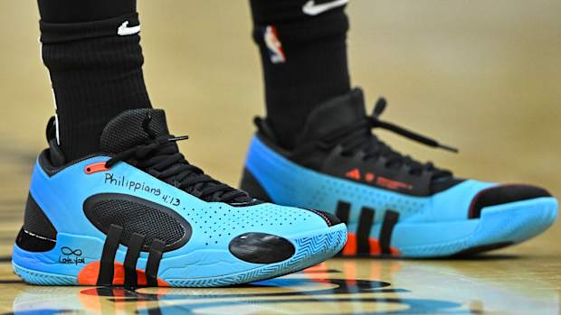 Cleveland Cavaliers guard Donovan Mitchell's blue and black adidas sneakers.