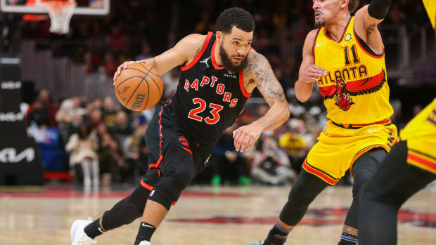 Feb 26, 2022; Atlanta, Georgia, USA; Toronto Raptors guard Fred VanVleet (23) drives on Atlanta Hawks guard Trae Young (11) in the second quarter at State Farm Arena.