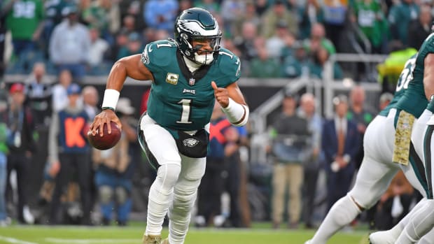 Philadelphia Eagles quarterback Jalen Hurts runs with the ball against the Dallas Cowboys.
