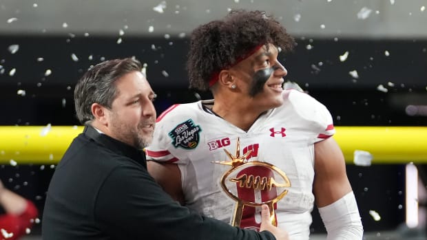 Wisconsin running back Braelon Allen holding the Las Vegas Bowl MVP trophy.