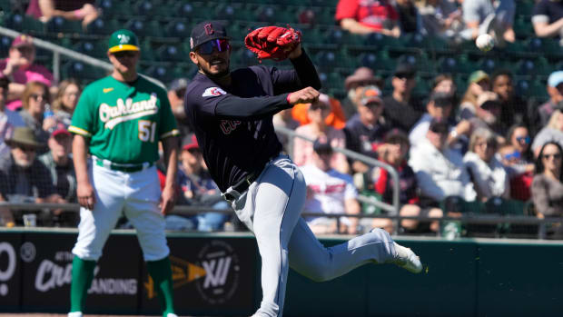 Mar 4, 2023; Mesa, Arizona, USA; Cleveland Guardians third baseman Gabriel Arias (8) makes the off balance throw against the Oakland Athletics in the first inning at Hohokam Stadium. Mandatory Credit: Rick Scuteri-USA TODAY Sports
