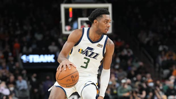 Utah Jazz guard Trent Forrest dribbles the ball.