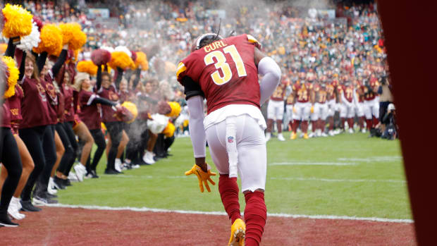 Washington Commanders safety Kamren Curl takes the field before a game.