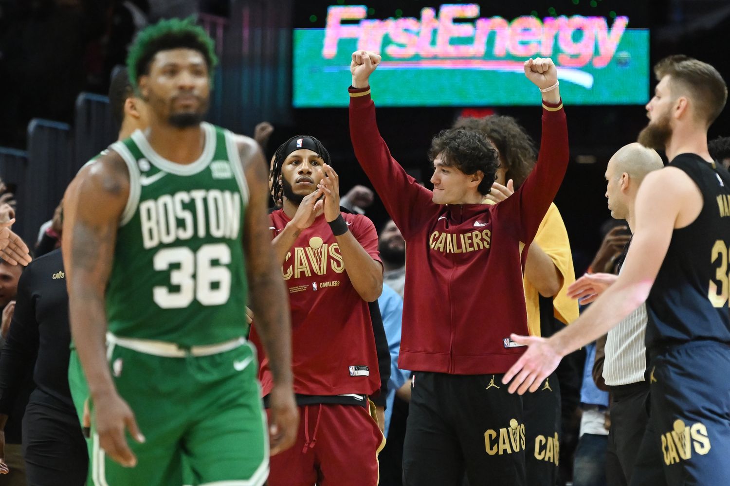 Nov 2, 2022; Cleveland, Ohio, USA; Cleveland Cavaliers forward Cedi Osman (16) celebrates as Boston Celtics guard Marcus Smart (36) walks off the court after the Cavaliers beat the Celtics at Rocket Mortgage FieldHouse. Mandatory Credit: Ken Blaze-USA TODAY Sports