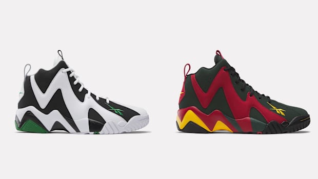 Side view of Shawn Kemp's white and black Reebok sneakers.