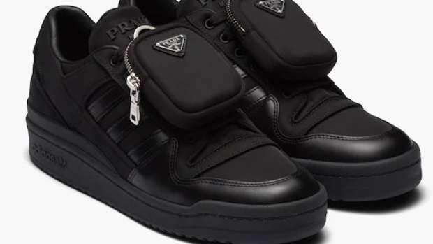 View of all black adidas forum low shoes.
