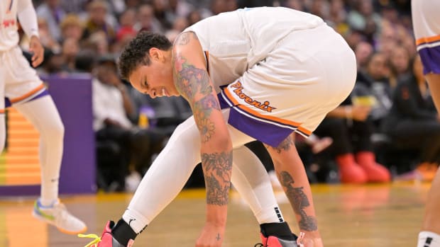 Phoenix Mercury center Brittney Griner falls down on the court.