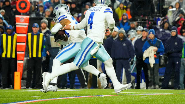 Dallas Cowboys quarterback Dak Prescott's white and grey Air Jordan cleats.
