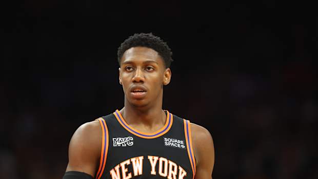 RJ Barrett walking down the court.