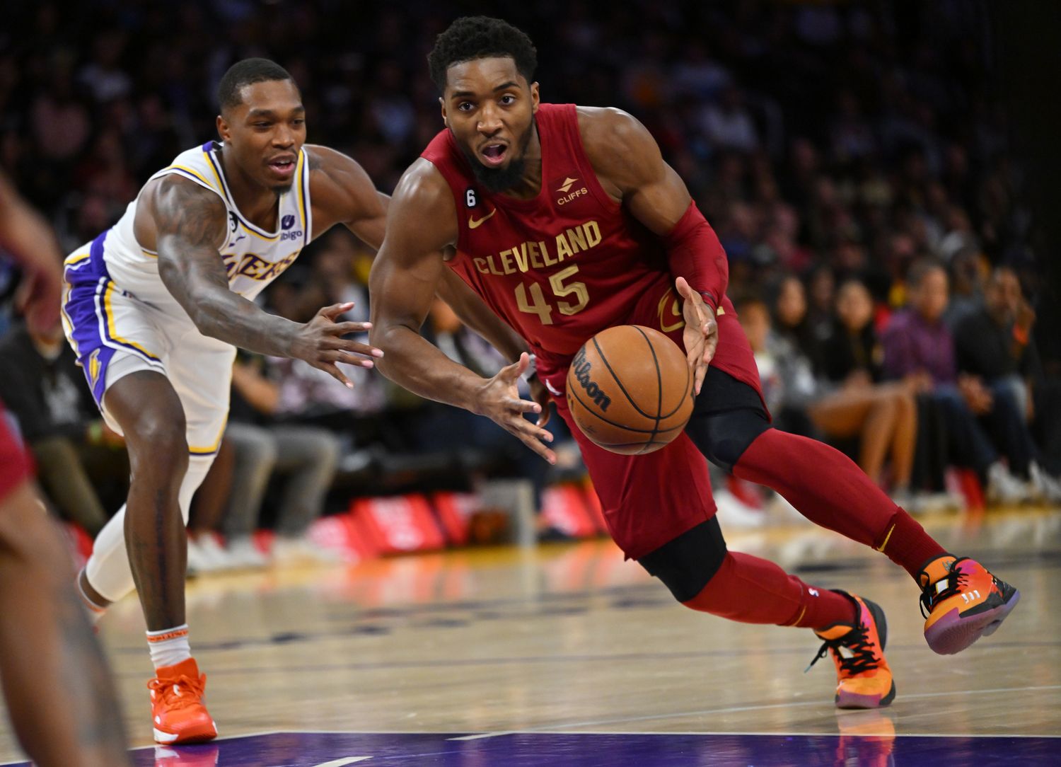 Cleveland Cavaliers guard Donovan Mitchell (45) drives past Los Angeles Lakers guard Lonnie Walker IV (4) for a basket in the first half at Crypto.com Arena.