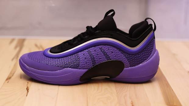 Side view of Donovan Mitchell's purple and black adidas sneaker.