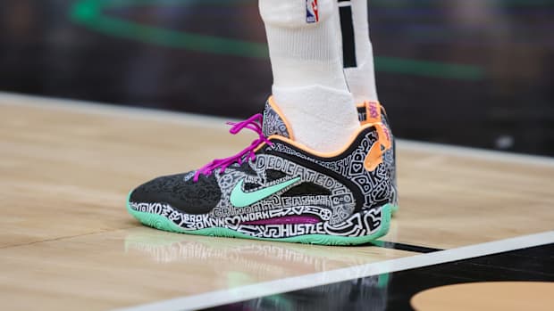 View of Kevin Durant's black and green Nike shoes.