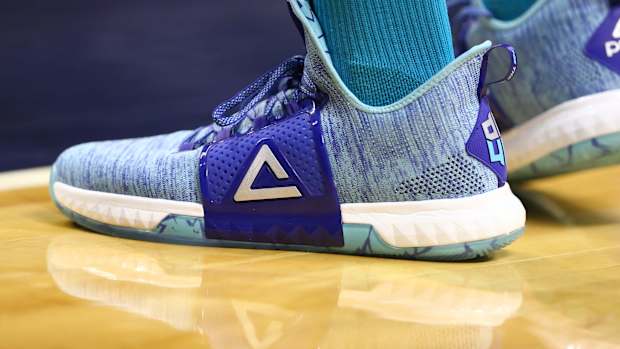 View of blue and green Peak shoes.