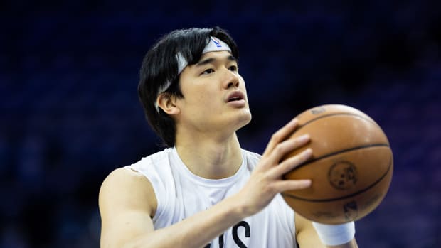 Brooklyn Nets forward Yuta Watanabe warms up before a game.