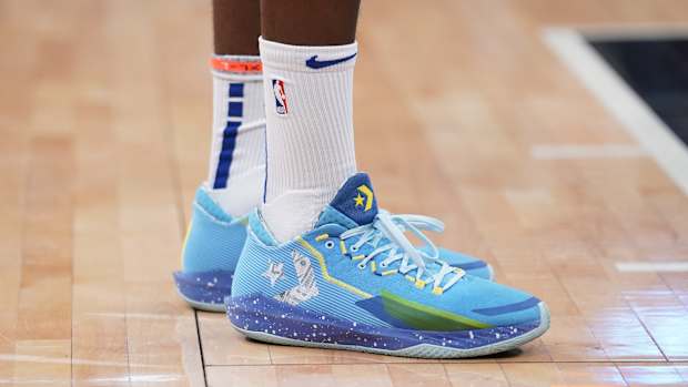 View of Draymond Green's blue Converse shoes.