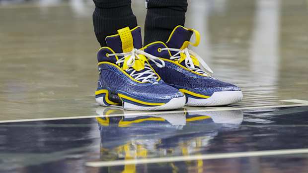 Orlando Magic center Moritz Wagner's navy and maize Air Jordan sneakers.