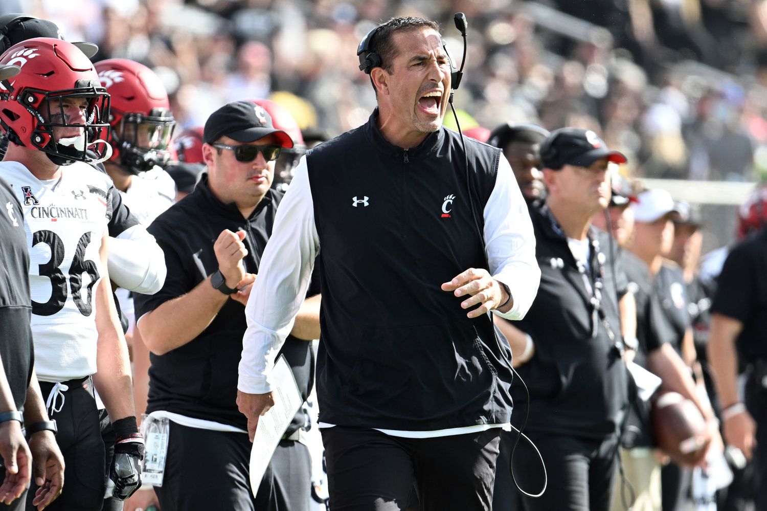 Luke Fickell yells out a play call from the Cincinnati sideline.