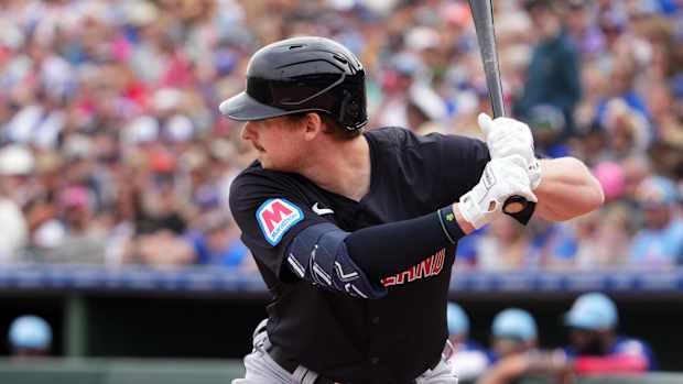 Mar 12, 2024; Surprise, Arizona, USA; Cleveland Guardians designated hitter Kyle Manzardo (73) bats against the Texas Rangers during the second inning at Surprise Stadium. Mandatory Credit: Joe Camporeale-USA TODAY Sports