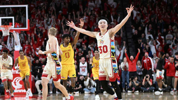 Nebraska Cornhuskers guard Keisei Tominaga reacts after scoring a three-point basket.