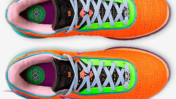 View of orange, purple, and pink Nike LeBron shoes.