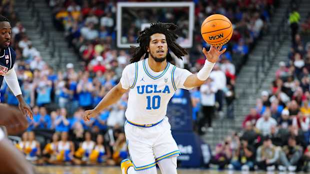 UCLA Bruins guard Tyger Campbell passes the ball.