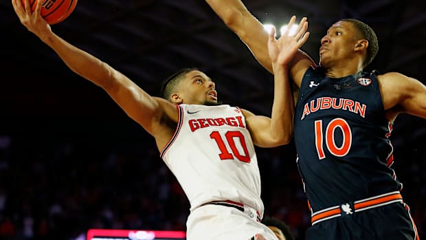 Feb. 5, 2022; Athens, Georgia, USA; Georgia Bulldogs guard Aaron Cook (10) shoots over Auburn Tigers forward Jabari Smith (10) at Stegeman Coliseum. Mandatory Credit: Joshua L. Jones/Athens Banner-Herald via USA TODAY NETWORK Ncaa Basketball Auburn At Georgia