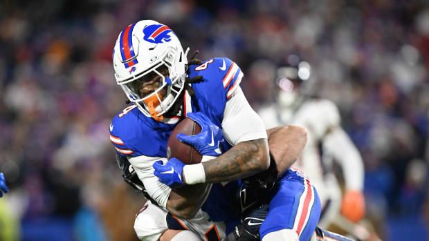Buffalo Bills running back James Cook gets tackled against the Denver Broncos.