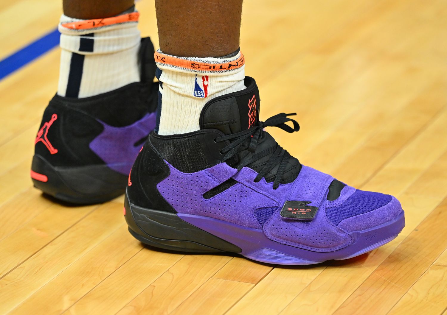 View of Zion Williamson's purple and black Jordan Brand shoes.