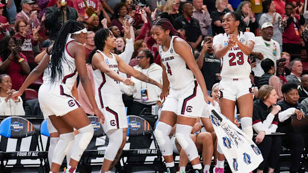 South Carolina Gamecocks bench celebrates during a game.