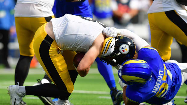 Pittsburgh Steelers quarterback Kenny Pickett (8) is brought down by Los Angeles Rams linebacker Michael Hoecht (97) during the first half at SoFi Stadium.