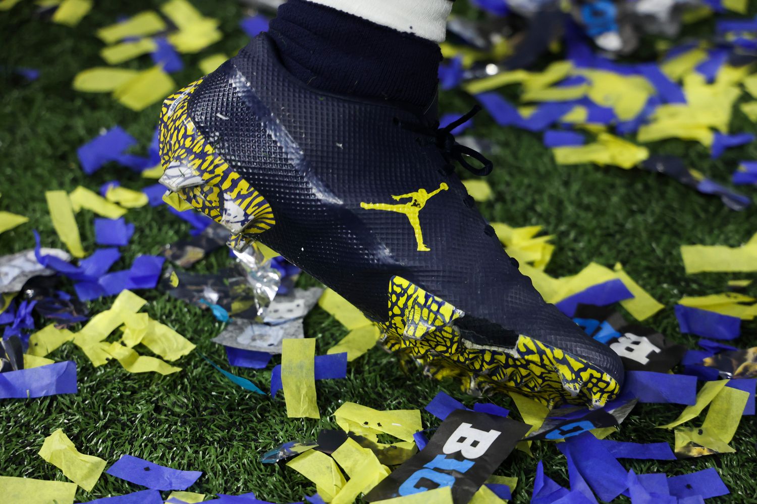 A Michigan Wolverines' football players' navy Jordan Brand cleats.