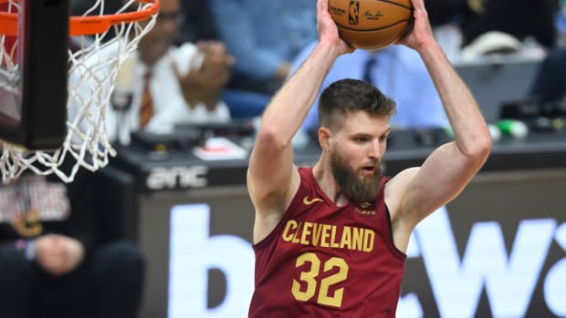 Dec 20, 2023; Cleveland, Ohio, USA; Cleveland Cavaliers forward Dean Wade (32) rebounds in the first quarter against the Utah Jazz at Rocket Mortgage FieldHouse. Mandatory Credit: David Richard-USA TODAY Sports