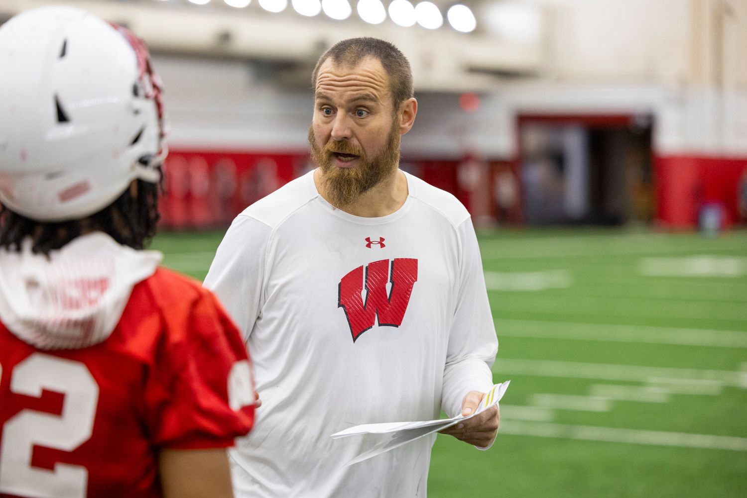 Wisconsin running backs coach Al Johnson speaking to his players during spring practice (Credit: Tom Lynn/UW Athletics)