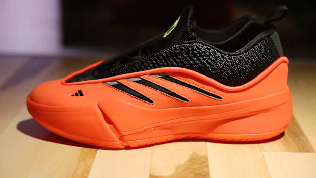 Side view of Damian Lillard's red and black adidas sneaker.