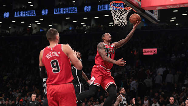 Bulls forward DeMar DeRozan shoots a layup.
