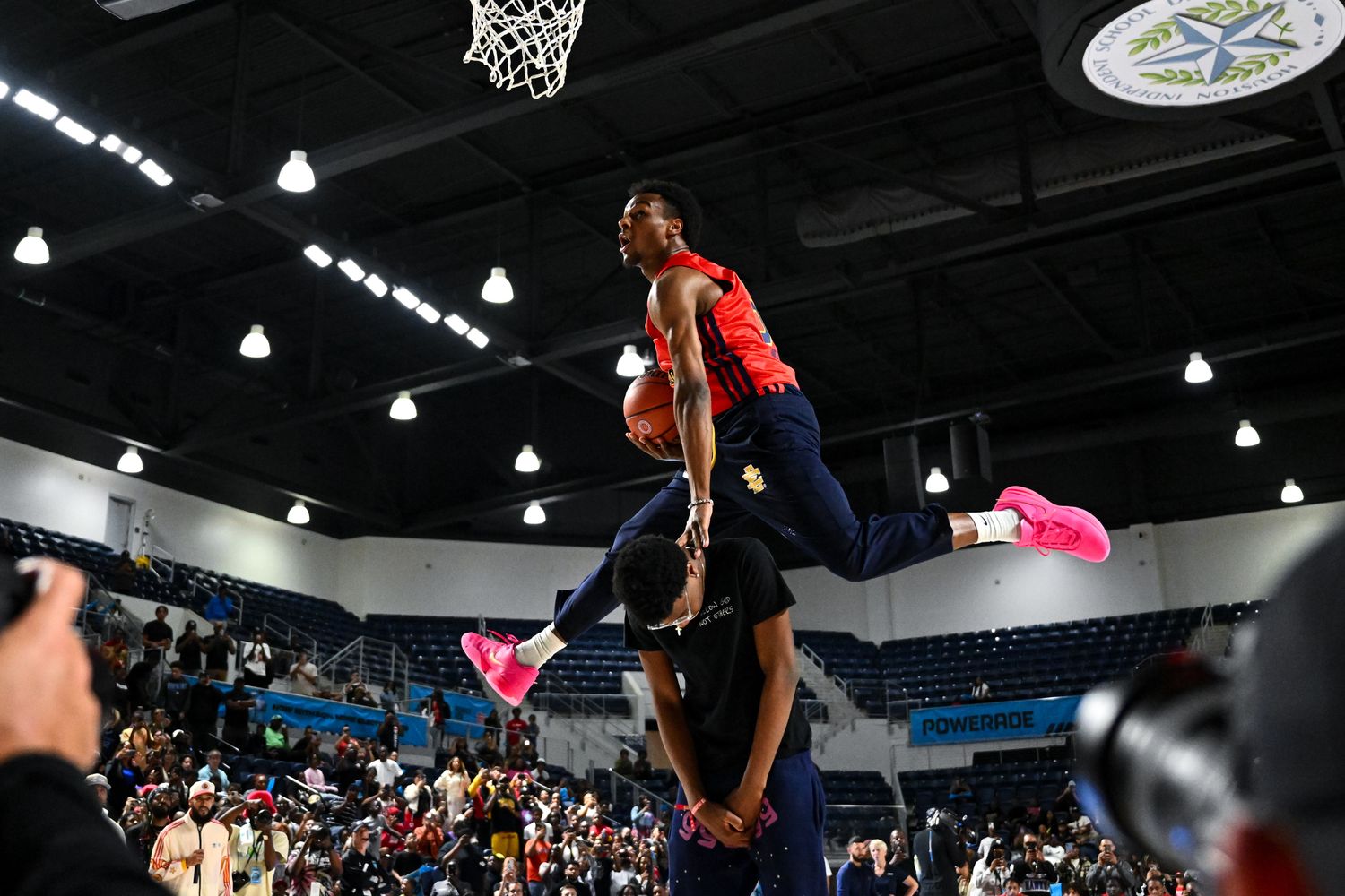 Bronny James jumps over his brother in a dunk contest.