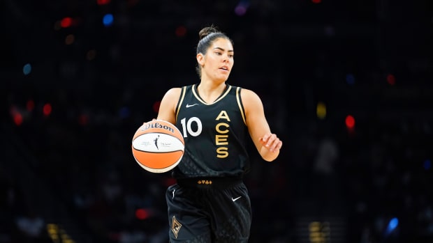 Las Vegas Aces guard Kelsey Plum dribbles the basketball.