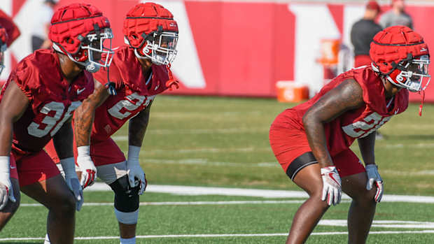 Razorback linebackers Jordan Crook, Chris "Pooh" Paul and Jaheim Thomas in practice Friday