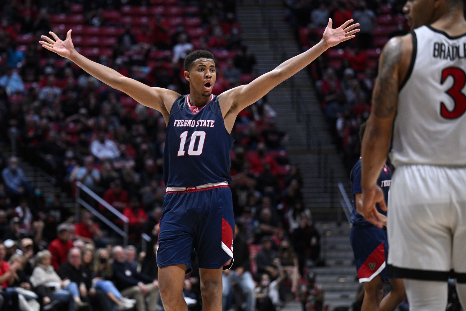 Fresno State Bulldogs forward Orlando Robinson (10) reacts after an offensive goaltending call on the Bulldogs during the second overtime against the San Diego State Aztecs at Viejas Arena.