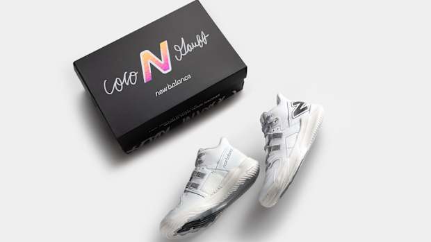 Coco Gauff's white and black New Balance tennis shoes and box.