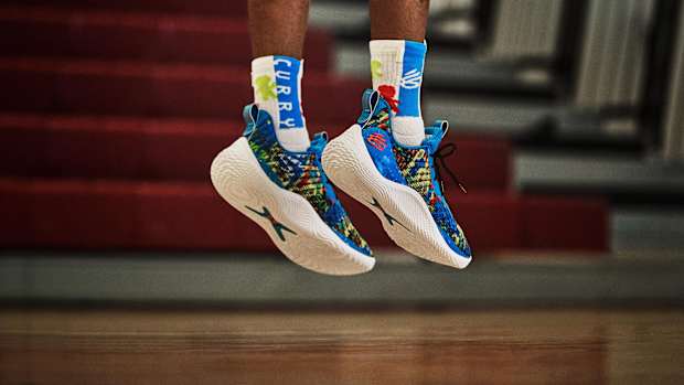 View of blue and white Curry shoes.