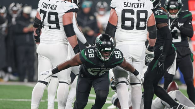 Jets edge rusher Carl Lawson celebrates a defensive play against Jacksonville in 2022