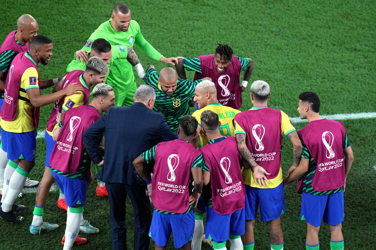 Brazil manager Tite pictured dancing with some of his players after a goal by Richarlison against South Korea at the 2022 FIFA World Cup