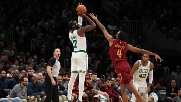 Mar 1, 2023; Boston, Massachusetts, USA; Boston Celtics guard Jaylen Brown (7) shoots the ball over Cleveland Cavaliers forward Evan Mobley (4) during the second half at TD Garden. Mandatory Credit: Bob DeChiara-USA TODAY Sports