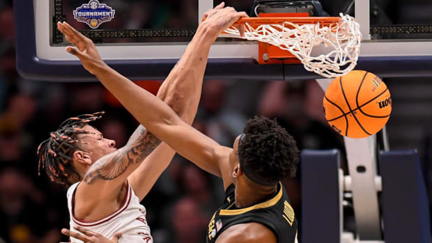 Razorbacks Trevon Brazile dunks against Vanderbilt in the SEC Tournament.