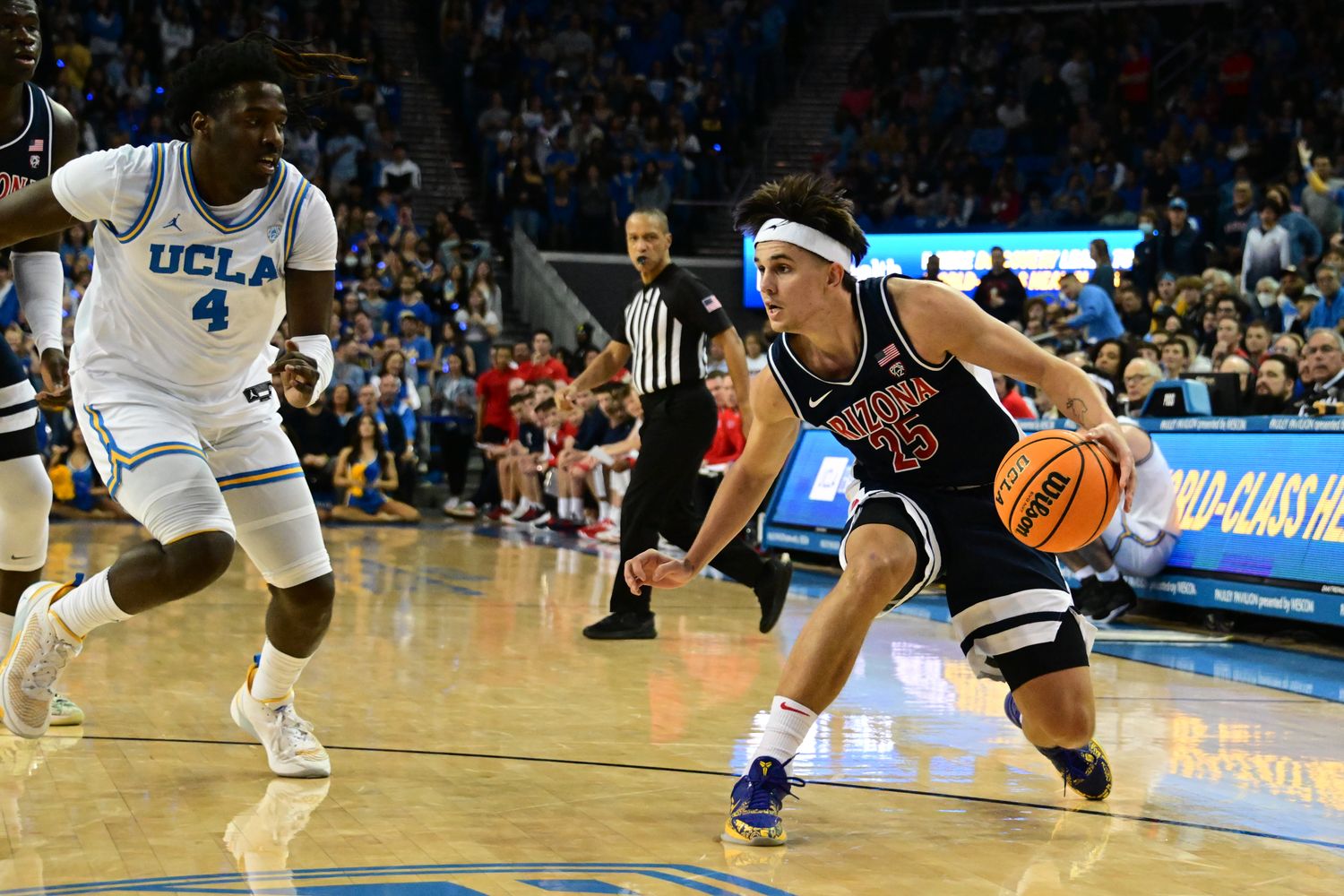 UCLA Bruins guard Will McClendon defends Arizona Wildcats guard Kerr Kriisa.