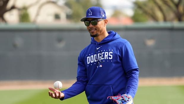 Dodgers outfielder Mookie Betts warms up at Spring Training.