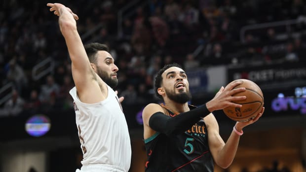 Jan 5, 2024; Cleveland, Ohio, USA; Washington Wizards guard Tyus Jones (5) drives to the basket against Cleveland Cavaliers guard Max Strus (1) during the second half at Rocket Mortgage FieldHouse. Mandatory Credit: Ken Blaze-USA